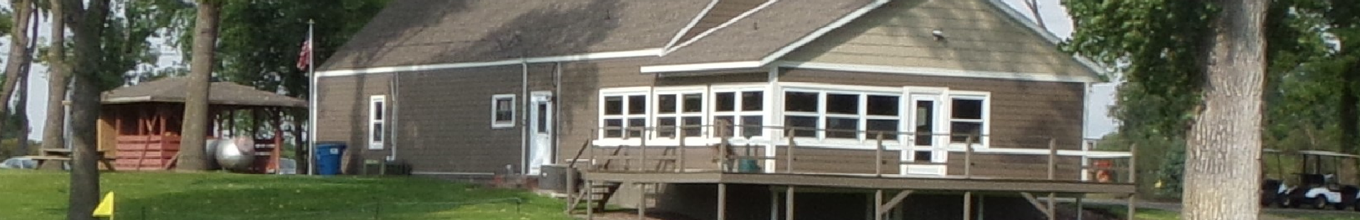 View of Winthrop Golf Club house from 9th hole green. Shows deck overlooking the 9th green.